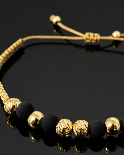 Pulsera Tejido Dorado Cuentas Negras