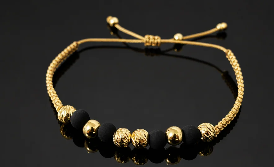 Pulsera Tejido Dorado Cuentas Negras
